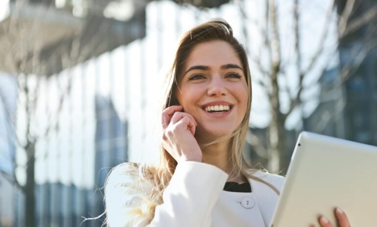 Woman In White Blazer Holding Tablet Computer